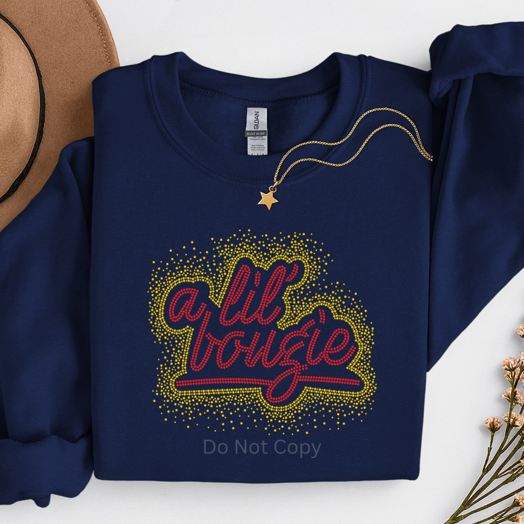 A Lil Bougie Red/Gold Rhinestone Transfer on a navy tshirt front side