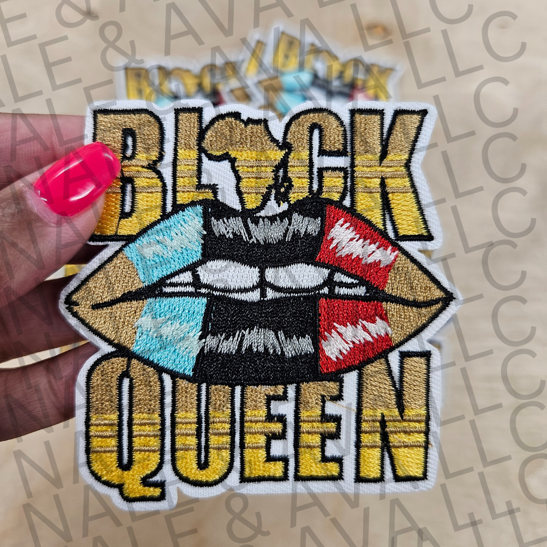 Embroidered patch with 'Black Queen' text and colorful lips held by a hand.