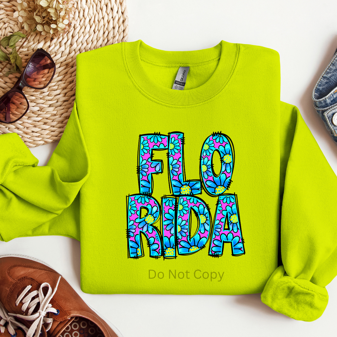 A bright green sweatshirt with the text 'FLO Florida' printed on it, using a direct to film transfer technique.