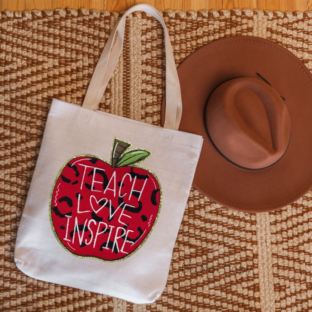 Teach Love Inspire Chenille Patch on a tote bag