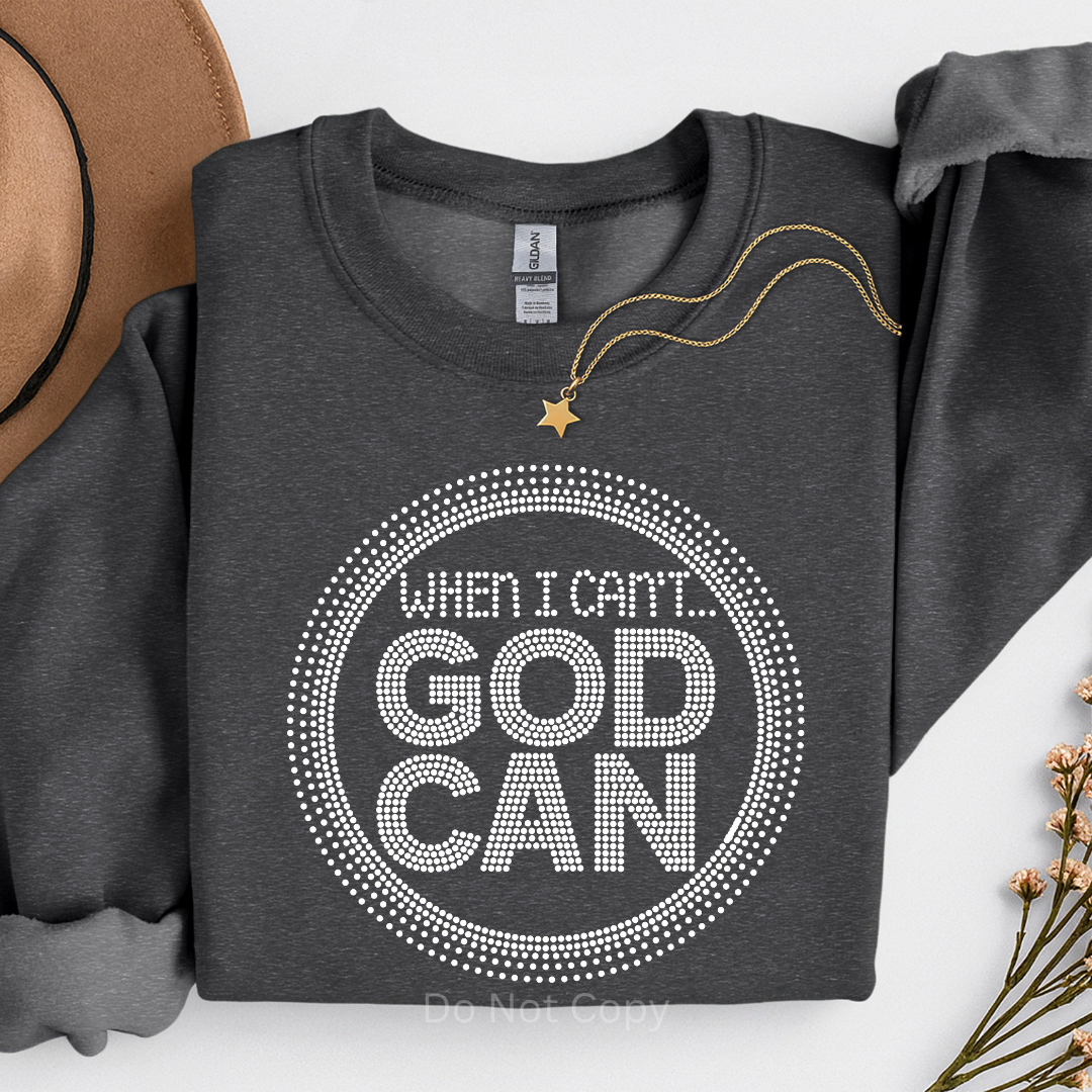 Dark gray sweatshirt with 'When I Can't... God Can' text design on a white background