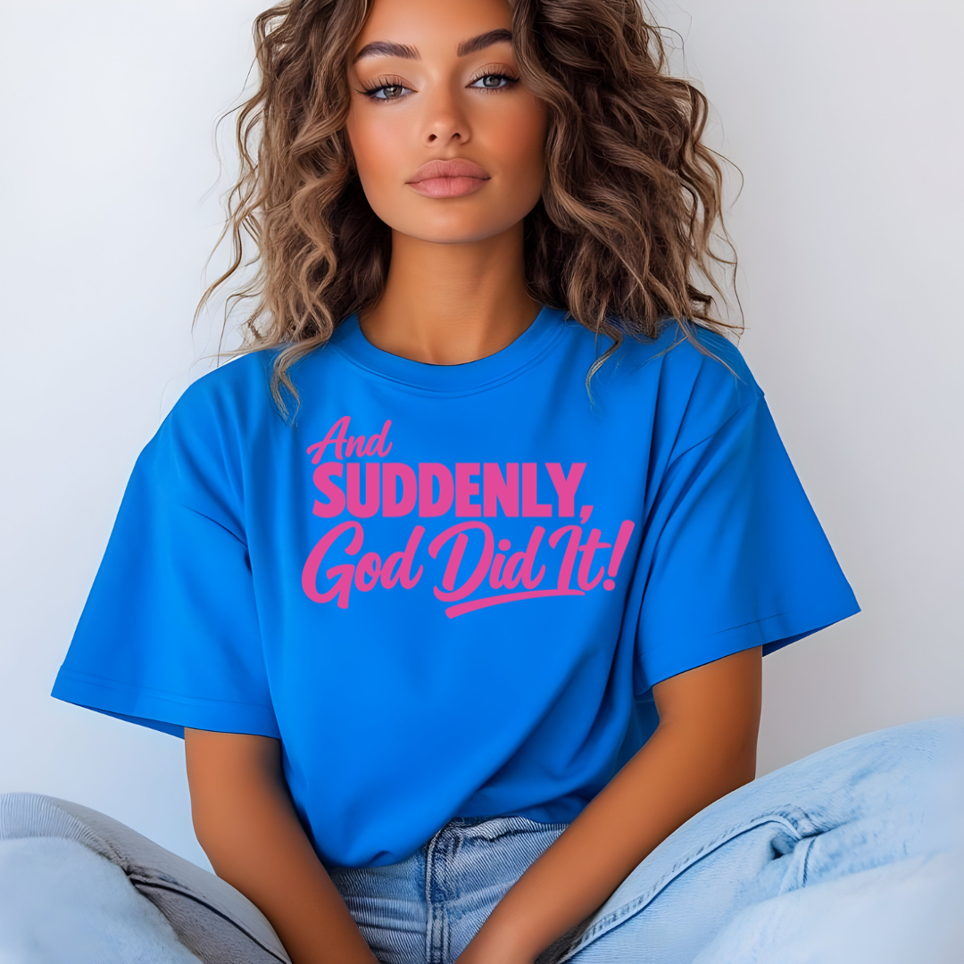 Person wearing a blue t-shirt with pink text against a plain background