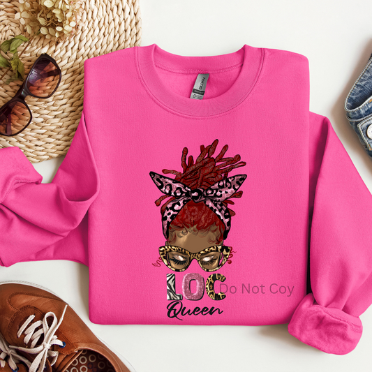 A pink crewneck sweatshirt with a graphic transfer design of a woman's face with accessories and the text '10x Queen'.