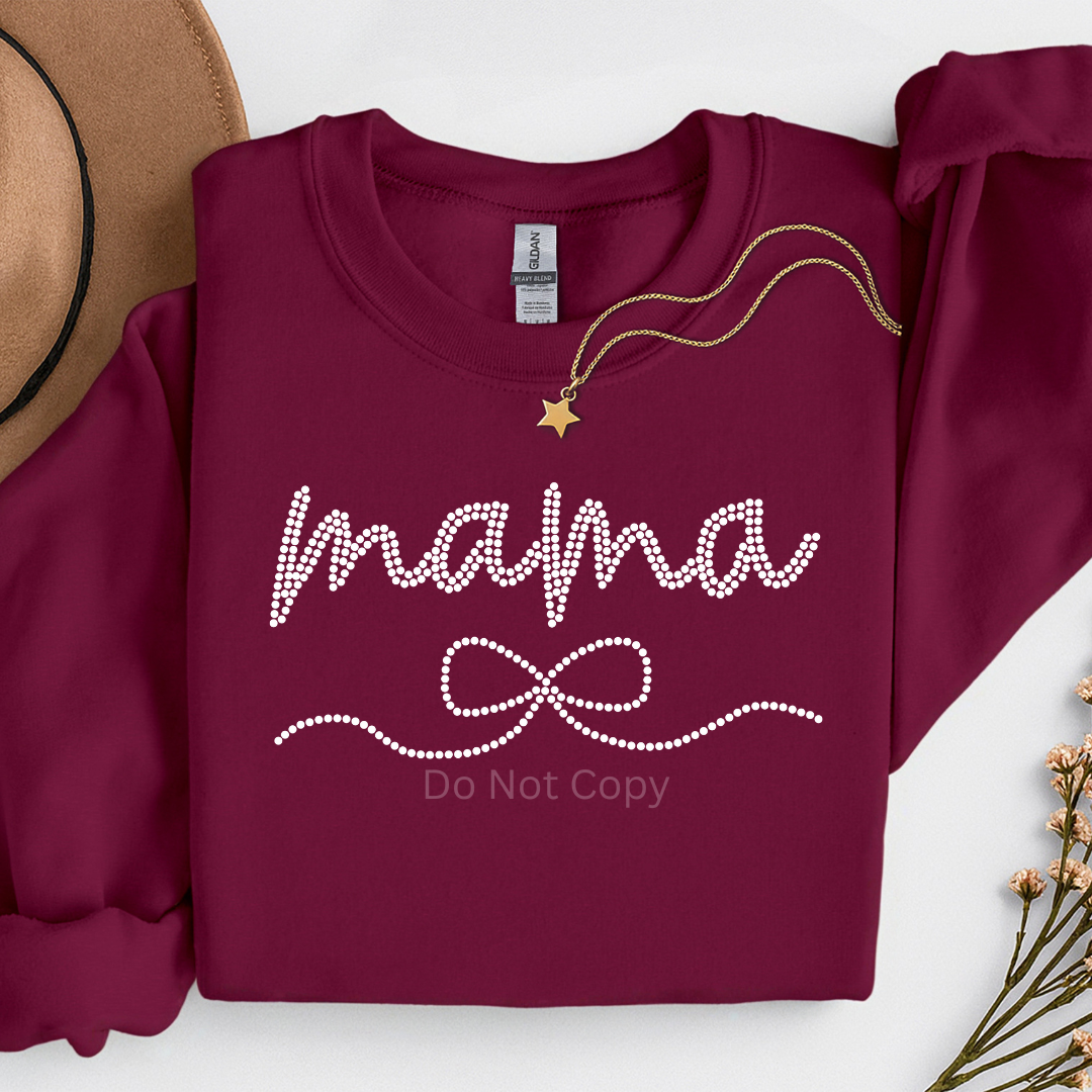 Mama Coquette Bow Pearl Transfer on a burgundy tshirt front side