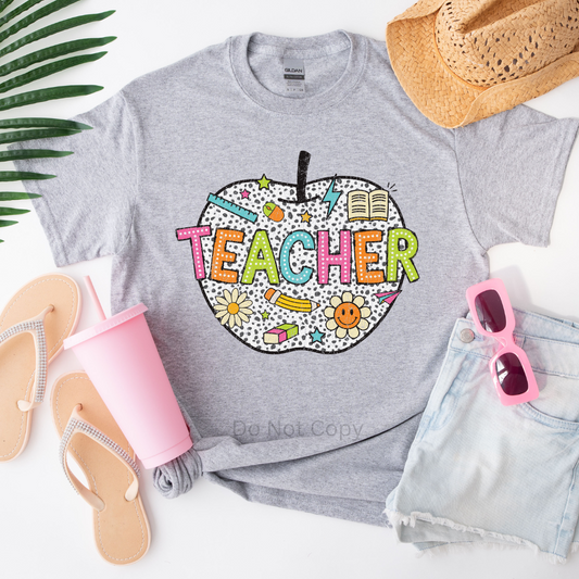 Teacher Apple DTF Transfer on a tshirt
