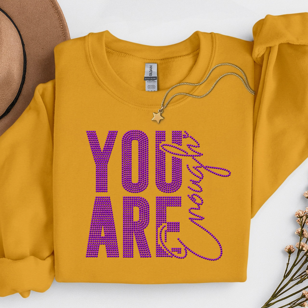 You Are Enough Semi Custom Spangle Transfer on a Gold Sweatshirt
