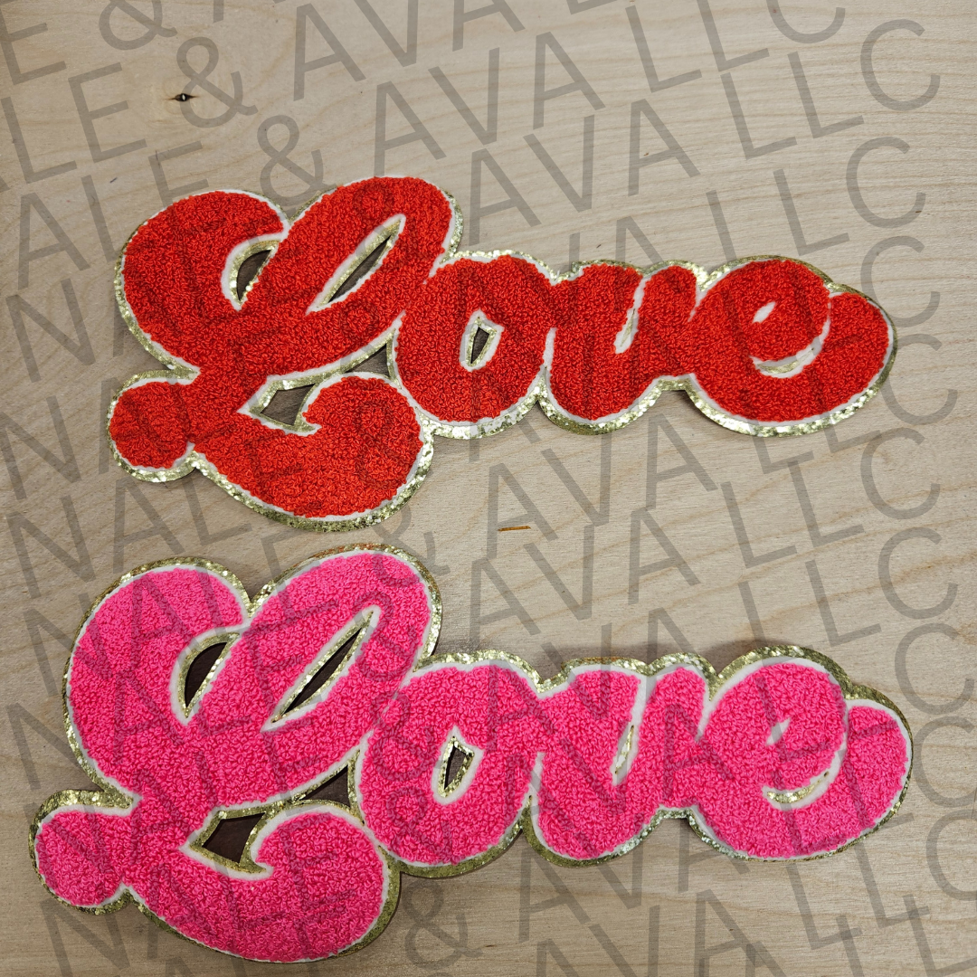 Two 'Love' patches, one red and one pink, on a textured surface with 'Avalon' branding.